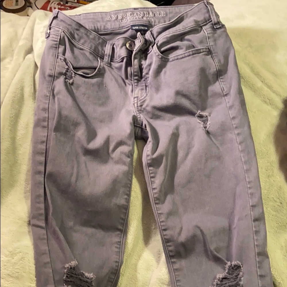 Grey distressed skinny jeans